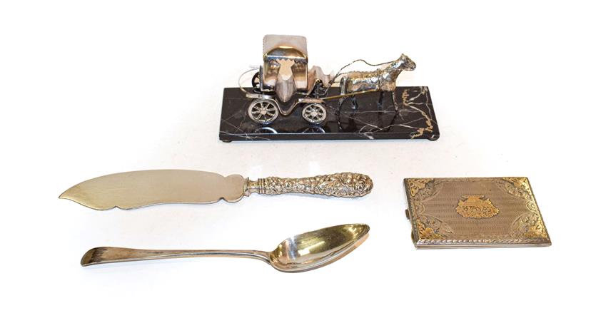 Lot 339 - A collection of silver including: An American silver serving slice, a George III silver table...