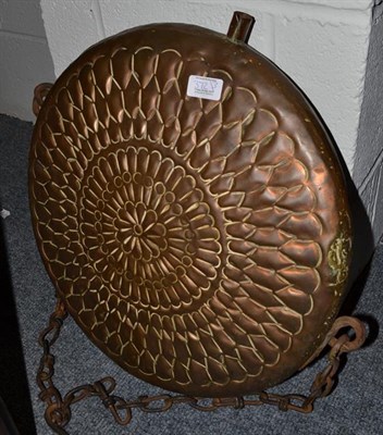 Lot 372 - A large near Eastern brass charger, 72cm diameter, another charger and a flask with embossed...