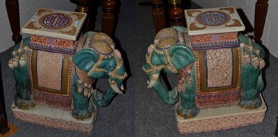 Lot 373 - A pair of 20th century Chinese earthenware elephant form garden seats, 54cm by 55cm high