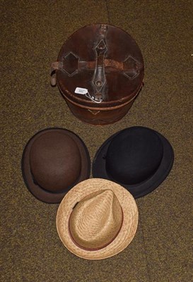 Lot 399 - A gentleman's top hat in leather case, two bowler hats and another