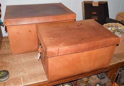 Lot 422 - Two modern graduated tan brown leather boxes with carrying handles, the largest 68cm by 48cm by...