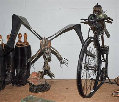 Lot 424 - Two pieces of original metal artwork, alien bird and man on bike (2)