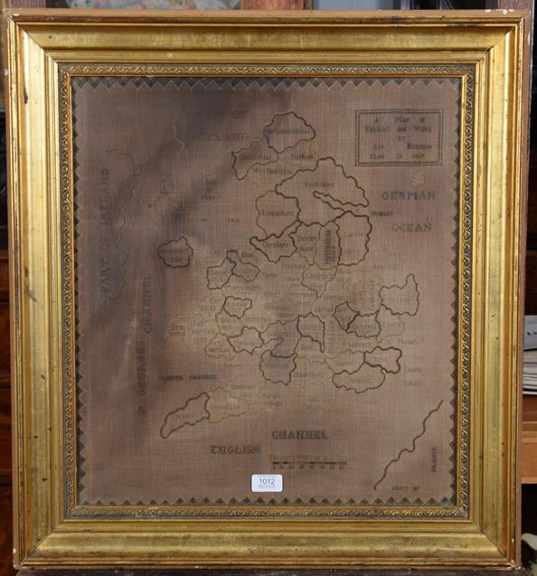Lot 1012 - A 19th century framed map sampler worked by Ann Hampson, 1837, depicting England and Wales, 53cm by
