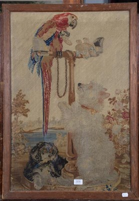 Lot 1016 - An 18th century woolwork picture of a parrot seated on a stand, with two dogs, oak framed, 78cm...