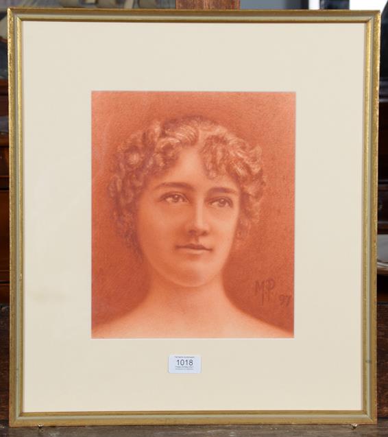 Lot 1018 - A pastel portrait of a young lady, monogrammed M P 1897, 29cm by 24cm