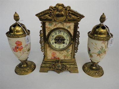 Lot 1412 - A French Gilt Brass Striking Mantel Clock with Garniture, circa 1890, arched case with pottery...