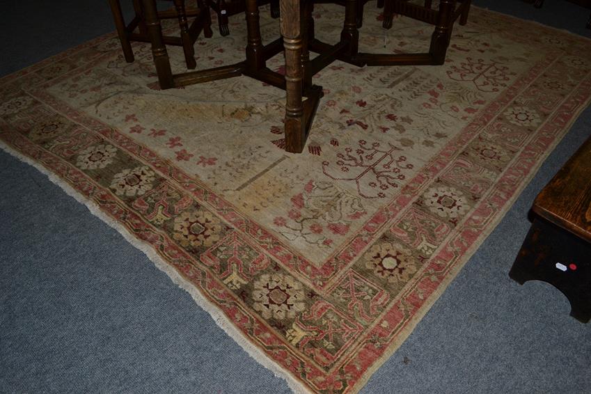 Lot 1097 - An Ushak Design Carpet, probably Afghanistan, the cream field with a oneway design of plants in...