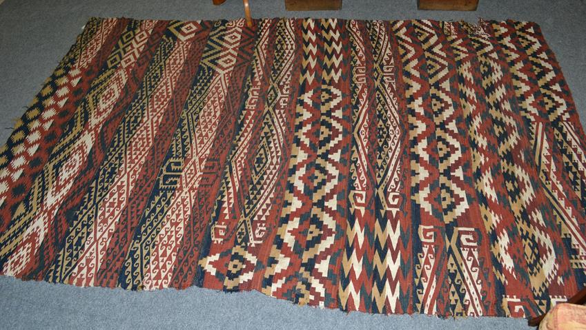 Lot 1098 - A 19th century Shahsavan Kilim, the field of narrow and broad bands of polychrome motifs...