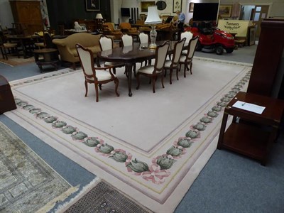 Lot 1099 - A large cream ground carpet with floral border, by Signature Carpets, Hebden Bridge, 6.3m by 4.76m