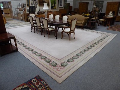 Lot 1099 - A large cream ground carpet with floral border, by Signature Carpets, Hebden Bridge, 6.3m by 4.76m
