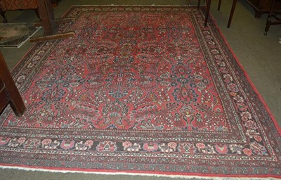 Lot 1104 - A Lilihan Carpet, the faded strawberry fields of flowering plants enclosed by meandering vine...