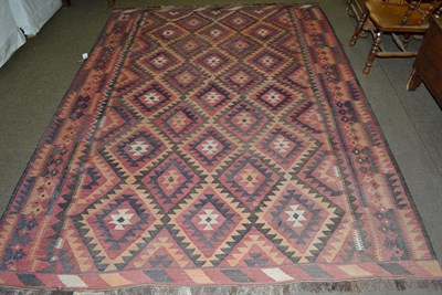 Lot 1106 - A Maimana Kilim, the separated diamond lattice field enclosed by borders of reciprical motifs,...