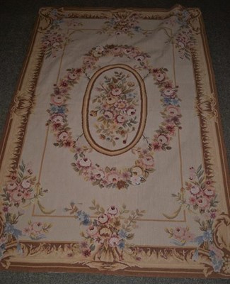 Lot 1109 - An Aubusson Style needlepoint rug, the wheat field centered by a frame of naturalistic flowers...