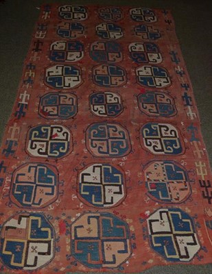Lot 1110 - An Usbek flat weave rug, the faded madder field with a column of elephant foot guls, 262cm by 137cm