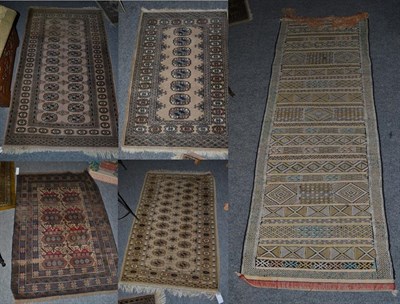 Lot 1112A - A Moroccan Berber flatweave runner, the field with narrow and broad bands of geometric motifs,...