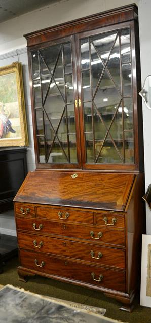 Lot 1113 - A George III mahogany bureau bookcase with fitted interior, 120cm by 56cm by 247cm (the top a...