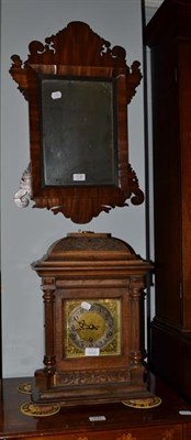 Lot 1118 - A German quarter chiming walnut cased table clock, 32cm by 21cm by 45cm; together with a...