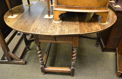 Lot 1136 - A 19th century oak gateleg dining table, 150cm by 126cm by 72cm