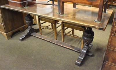 Lot 1147 - An early 20th century oak refectory dining table, 182cm by 81cm by 74cm raised on carved...