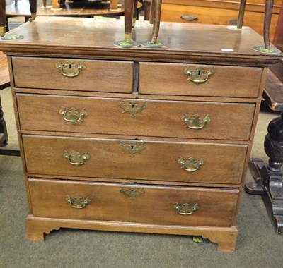 Lot 1151 - A Georgian oak straight front four height chest of drawers (two over three), 98cm by 49cm by 93cm
