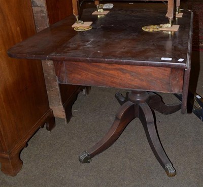 Lot 1153 - A 19th century mahogany single-drawer Pembroke table, raised on a turned centre pedestal and...