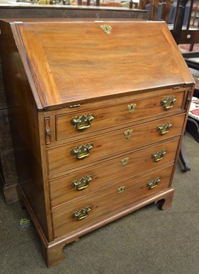 Lot 1155 - A George III mahogany bureau of small proportions, 76cm by 48cm by 101cm h