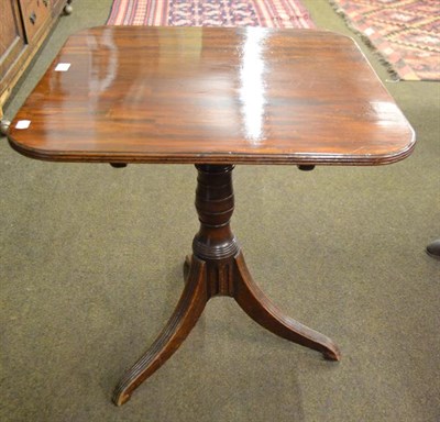 Lot 1160 - A 19th century mahogany tilt-topped tripod table, the square top with rounded corners and...