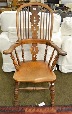 Lot 1167 - A 19th century yew and elm Windsor chair with out-scrolled arms and dish seat