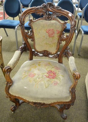 Lot 1176 - A Victorian scroll and floral carved rosewood-framed part-upholstered open armchair