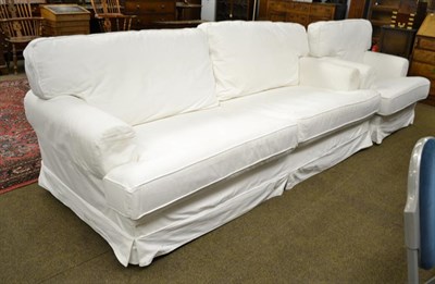 Lot 1178 - A modern white upholstered two-piece suite, comprising three-seater settee and an armchair (2)