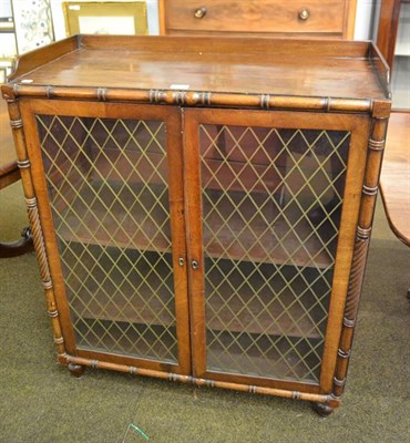 Lot 1191 - A Regency mahogany grill and glazed two-door cabinet with gallery, 85cm by 41cm by 103cm