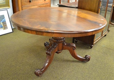 Lot 1192 - A Victorian mahogany tilt-top breakfast table raised on three carved scroll supports, 120cm...