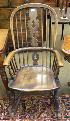 Lot 1199 - A 19th century elm Windsor rocking chair together with a 19th century yew and elm wheel back...