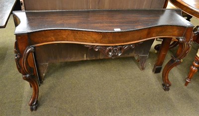 Lot 1206 - A 19th century mahogany console table of serpentine form (marble lacking) 75cm by 72cm,...