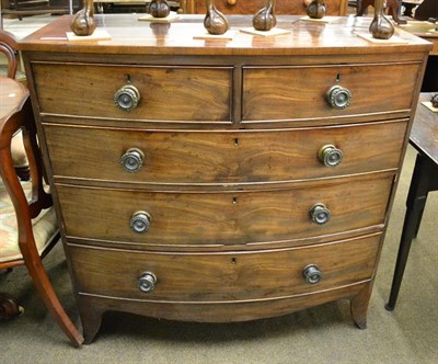 Lot 1207 - A George III cross-banded mahogany bow front chest of drawers, 106cm by 53cm by 105cm