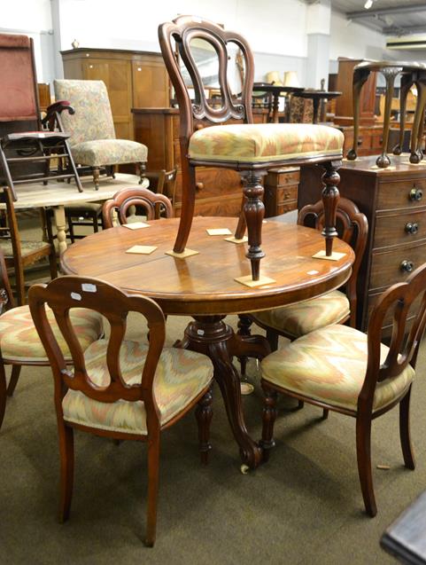 Lot 1209 - A set of six Victorian mahogany balloon back dining chairs, with stuffed seats and melon fluted...