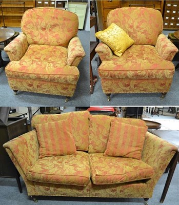 Lot 1253 - A modern three-piece suite comprising a three-seater sofa 177cm by 110cm by 92cm and a pair of...