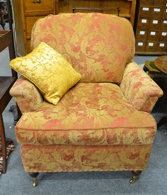 Lot 1253 - A modern three-piece suite comprising a three-seater sofa 177cm by 110cm by 92cm and a pair of...
