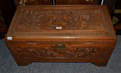 Lot 1302 - A Chinese carved camphor wood chest, 76cm by 38cm by 37cm