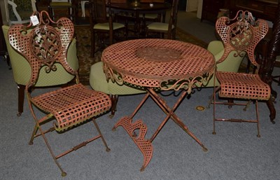 Lot 1308 - A modern metal bistro set comprising a circular table, 79cm by 74cm and a pair of matching...