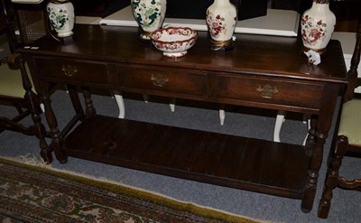 Lot 1316 - An oak dresser base with pot board stretcher, 153cm by 46cm by 75cm