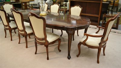 Lot 1323 - A 9 1/2 foot reproduction mahogany dining table, 290cm by 120cm by 74cm, with two addition...