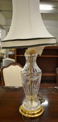 Lot 1324 - A good quality cut-glass table lamp with gilt metal base and silk shade, 58cm