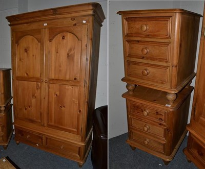Lot 1330 - A modern pine wardrobe, 125cm by 62cm by 202cm, together with a pair of matching three-drawer...
