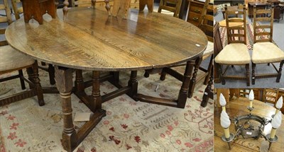Lot 1336 - A 17th century style oak gateleg dining table, 160cm by 160cm, open by 73cm; a set of eight...