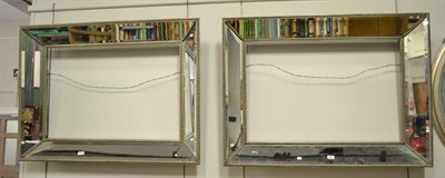 Lot 1341 - A pair of modern bevelled glass mirrored picture frames