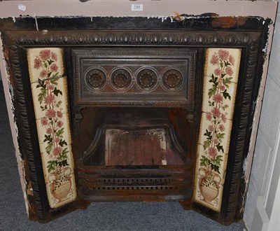 Lot 1344 - A Victorian cast iron fireplace with tiled insert, 97cm by 96.5cm
