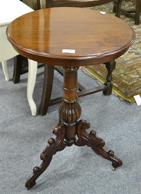 Lot 1346 - A mahogany centre pedestal occasional table raised on carved scrolling supports, 47cm dia. by...