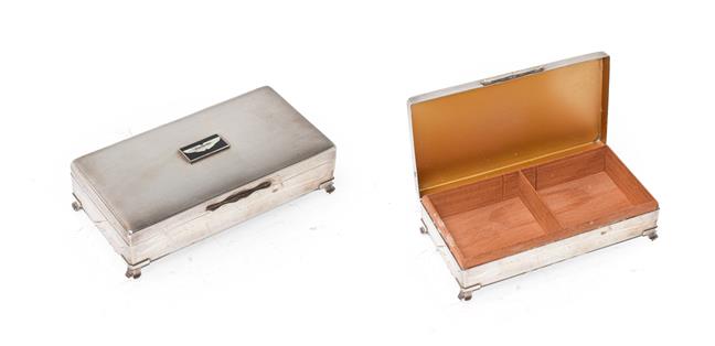 Lot 10 - A Silver Plated Desktop Cigarette Box, the lid with engine turned decoration and an Aston...