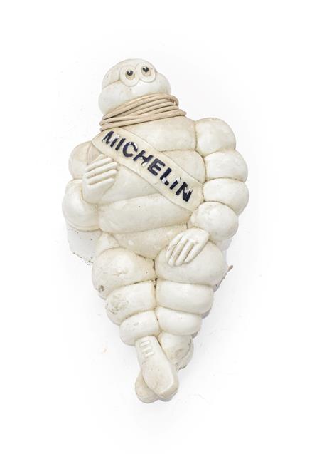 Lot 19 - An Illuminated Michelin Man Advertising Figure, seated on a metal mounted bracket fitted with...